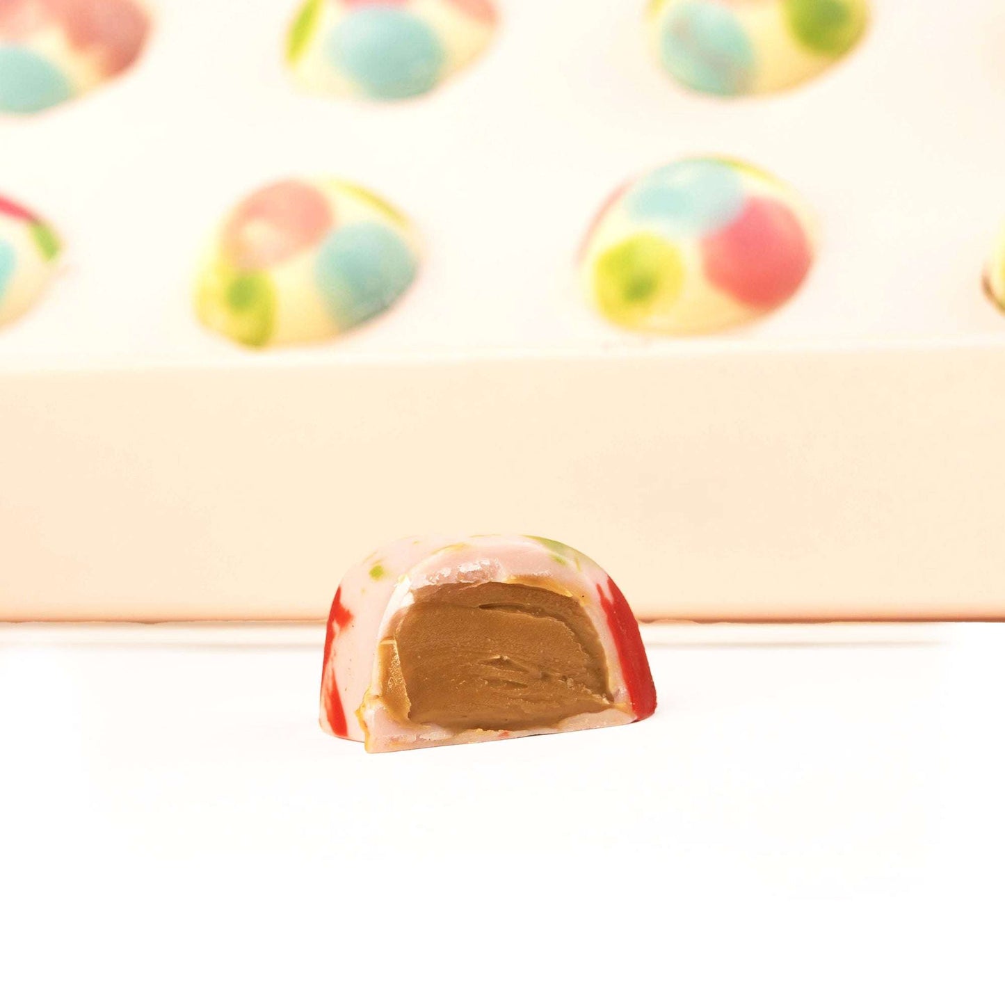 Close-up of a pastel decorated filled chocolate from the Sweet Birthday Surprise Box
