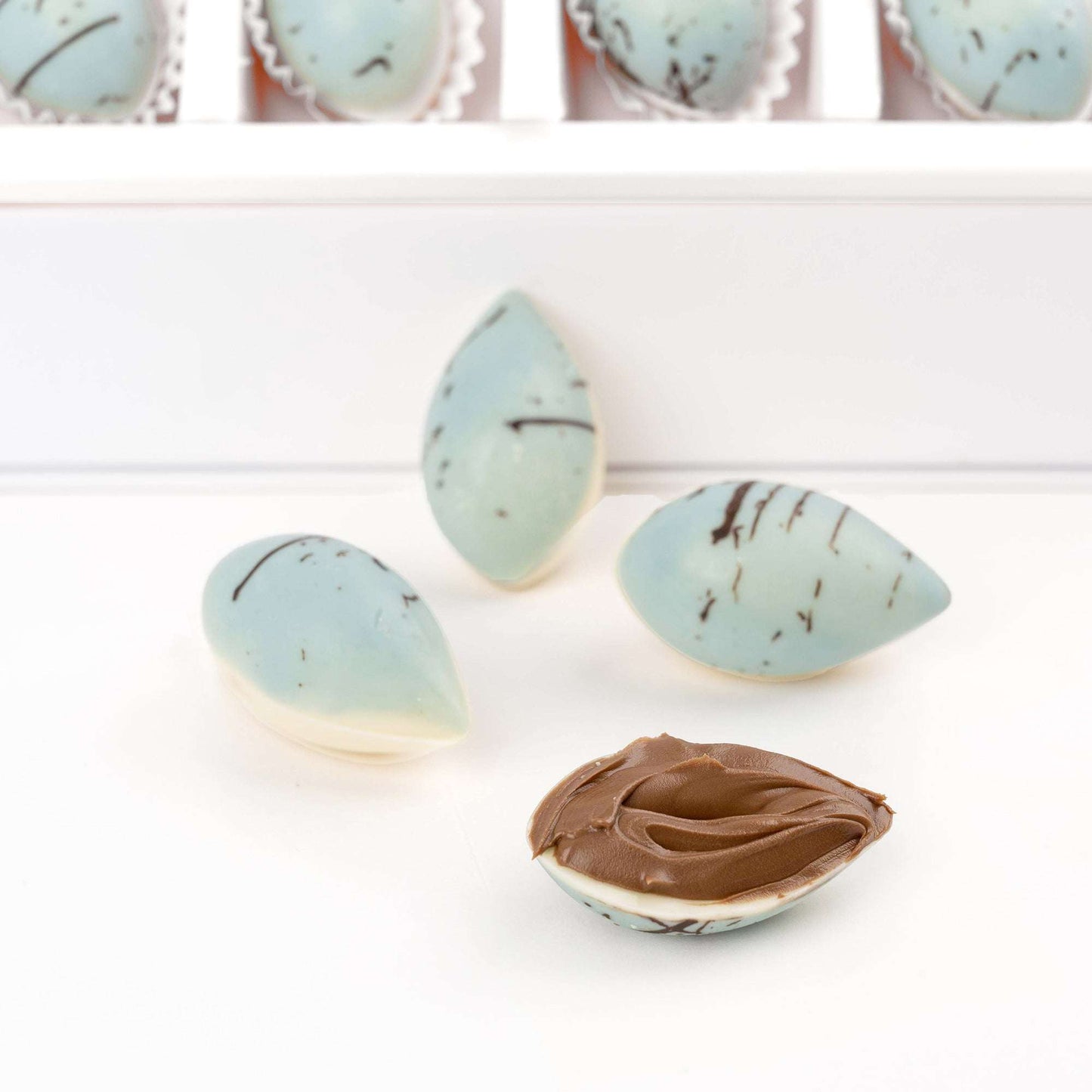 Close-up of blue decorated chocolates from the apology gift bundle