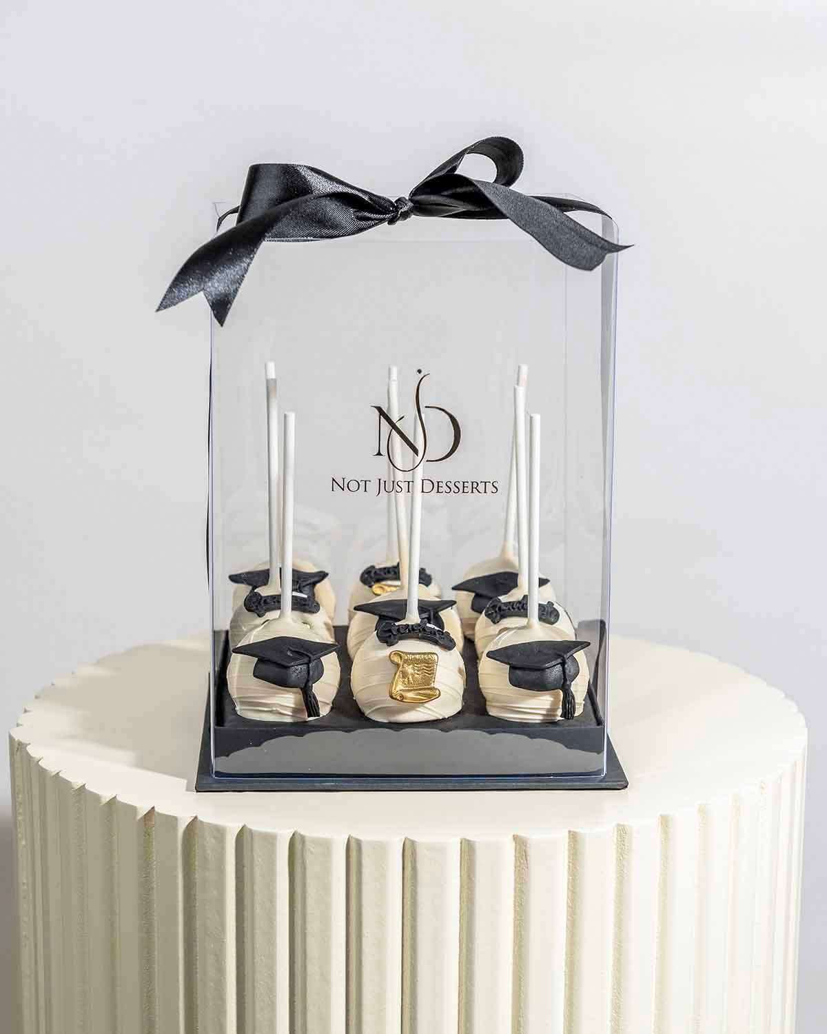 White Chocolate Graduation Cake Pops by NJD