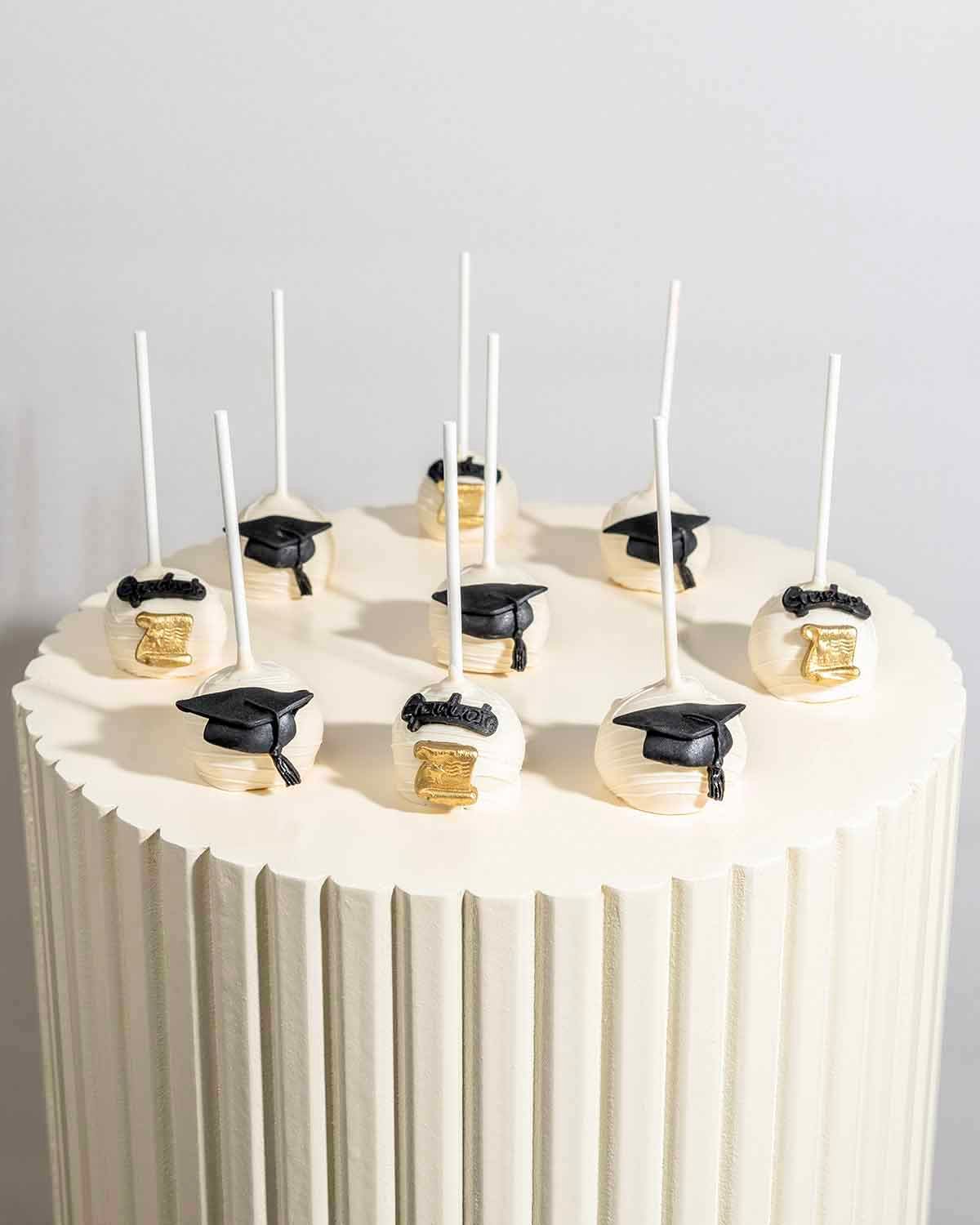 White Chocolate Graduation Cake Pops by NJD