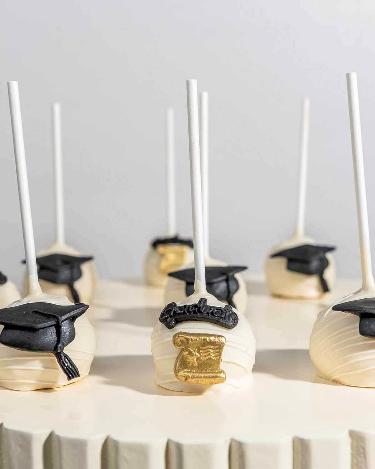 White Chocolate Graduation Cake Pops by NJD