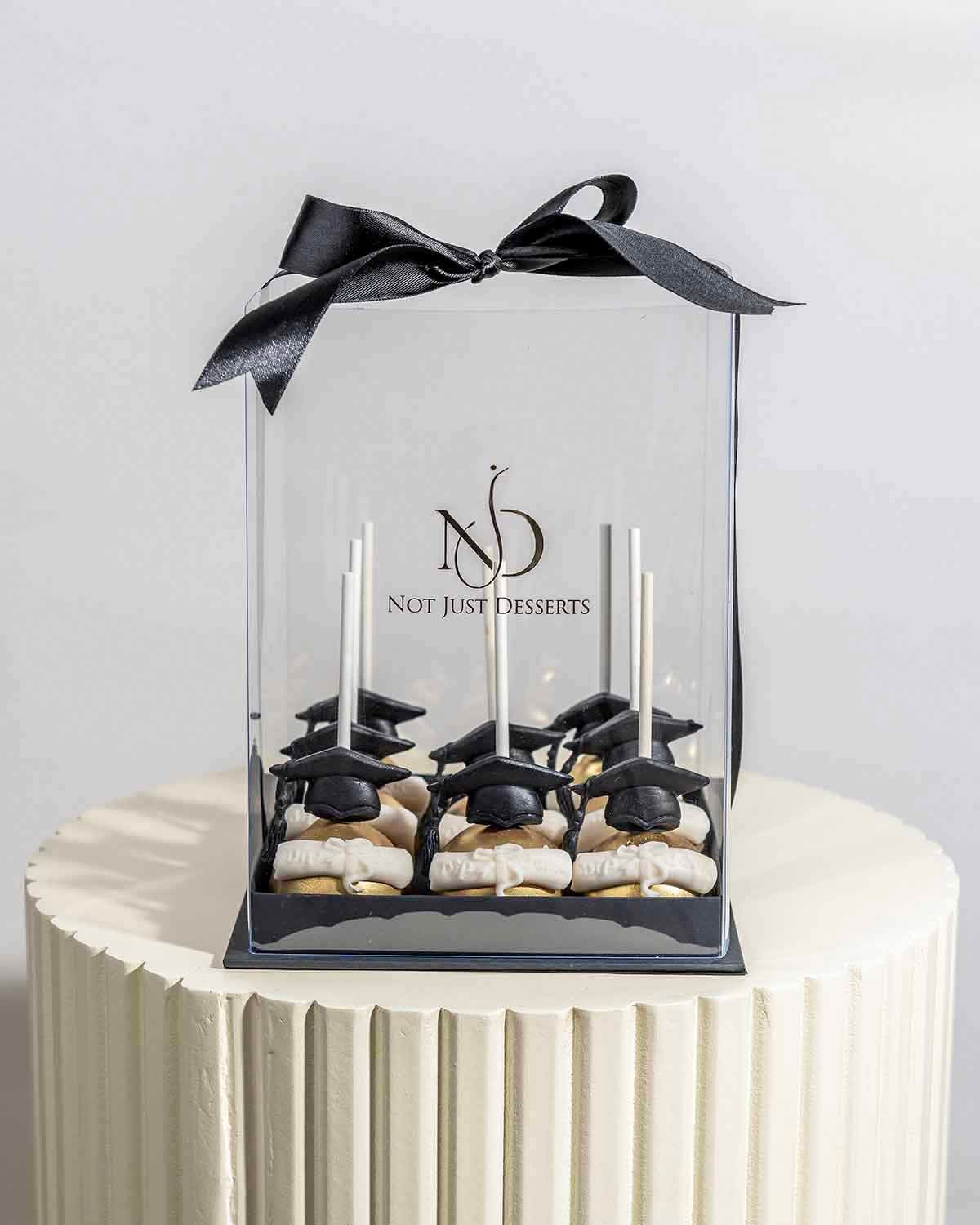 Graduation theme Chocolate Cake pops by NJD